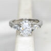 Custom Trilogy Engagement Ring with Platinum Band & Oval Cut Diamond with Pear Cut Diamond Side Stones